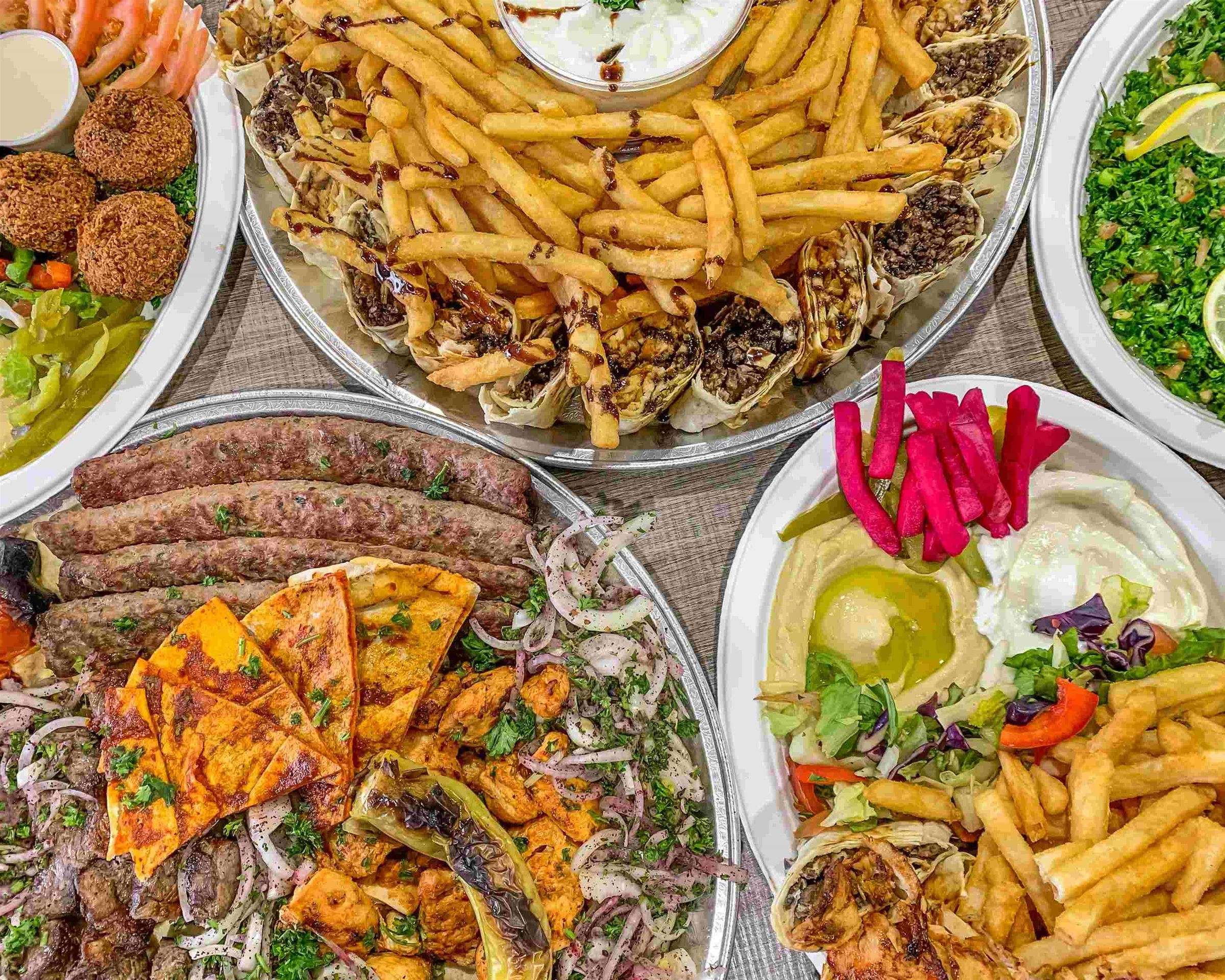 Aljazeera BBQ skewers, shawarma rolls with fries, falafel, hummus and tabbouleh